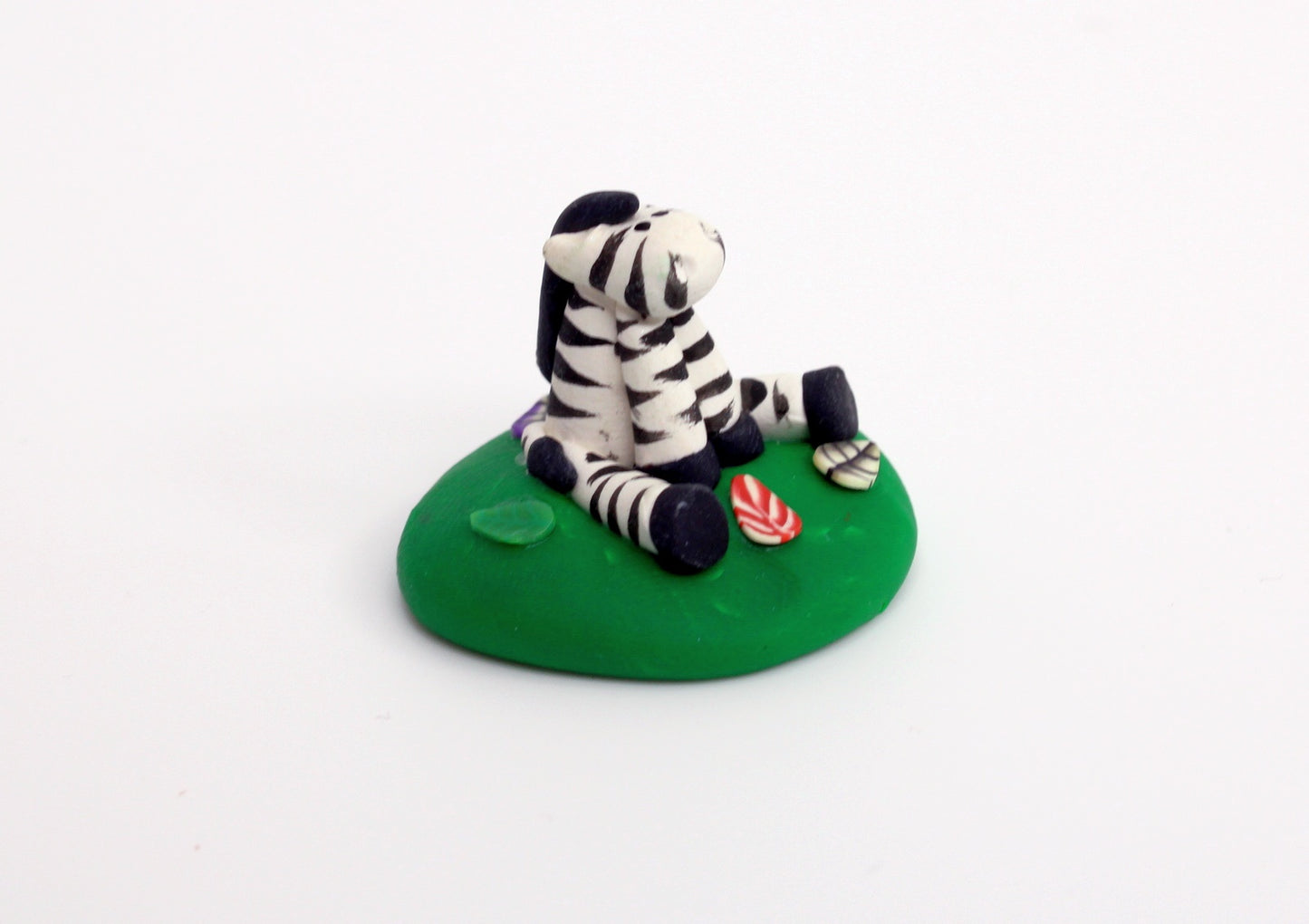 Zebra Sitting on Grass