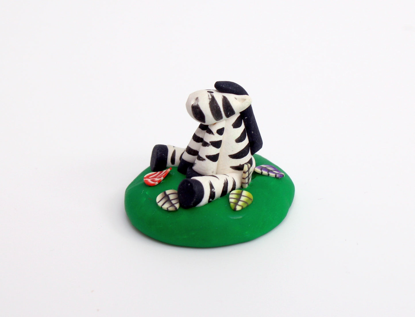 Zebra Sitting on Grass