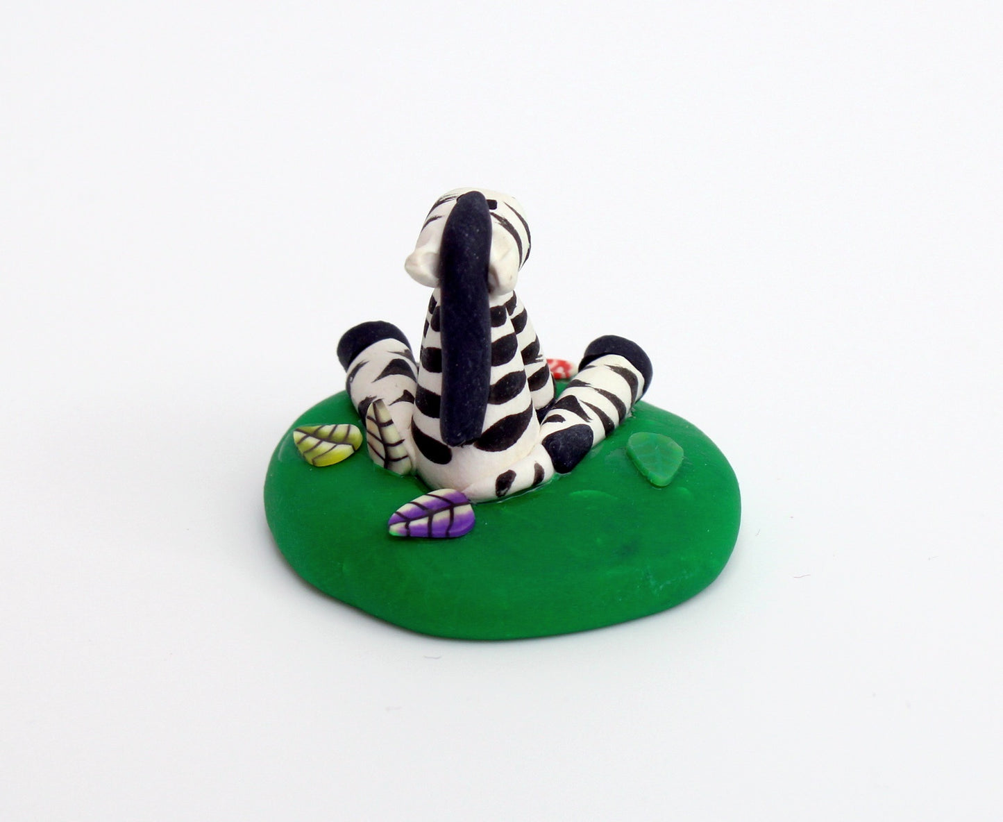 Zebra Sitting on Grass